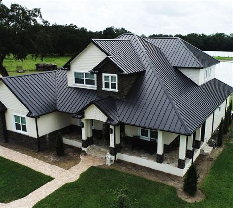 black metal roof blue house|black metal roofing near me.